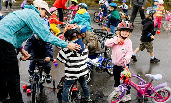 Kids cycling to kindergarten